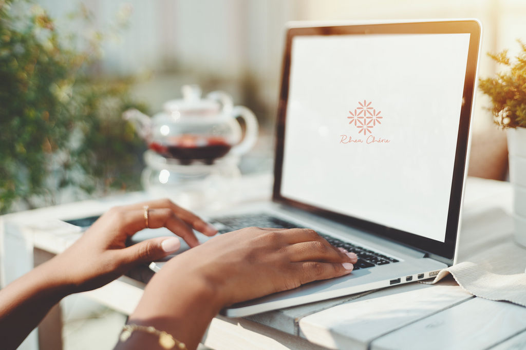 Woman at desk typing on computer
