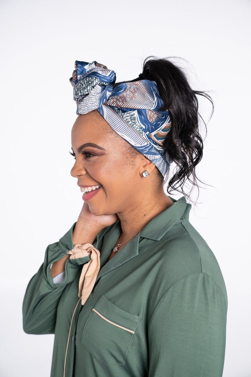 Woman is Rhea Cherie silk head scarf and green modern sleepshirt